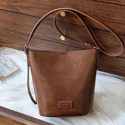 Vintage PU Leather Bucket Bag For Women Retro Solid Color Shoulder Crossbody Bag Minimalist Commuting Handbag With Adjustable Strap