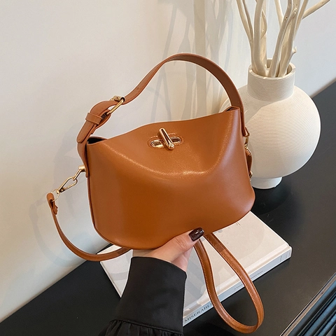 Minimalist PU Leather Bucket Bag For Women Gold Metal Lock Handbag Solid Color Adjustable Shoulder Strap Commuting Crossbody Bag