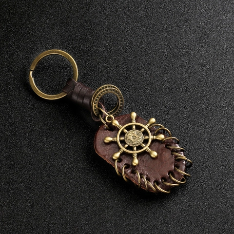 Porte-clés Vintage en Cuir et Alliage Avec Pendentif Aile d'Ange Gouvernail Note Musicale Bronze Rétro Anneau de Clé pour Voiture Sac à Dos Décoration Cadeau Unisexe