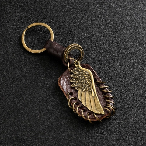 Porte-clés Vintage en Cuir et Alliage Avec Pendentif Aile d'Ange Gouvernail Note Musicale Bronze Rétro Anneau de Clé pour Voiture Sac à Dos Décoration Cadeau Unisexe