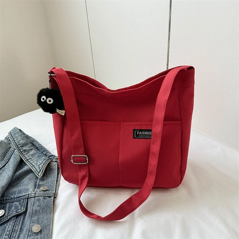 Borsa a Tracolla in Tela Grande Capacità Donna Moda Etichetta a Lettere Borsa Tote Con Pendaglio in Peluche Cinturino Regolabile