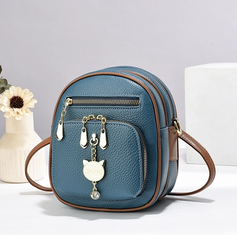 Mini Mochila De Cuero PU Con Patrón De Litchi Para Mujeres Chicas Colgante De Gato Dorado Bolso Bandolera De Capas Casual