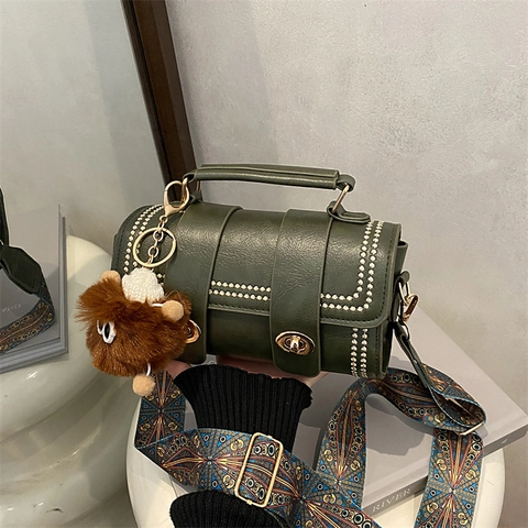 Women Retro PU Leather Cylinder Crossbody Bag With Rivets Ethnic Wide Shoulder Strap And Monster Furry Pendant Handbag