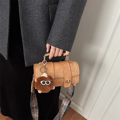 Women Retro PU Leather Cylinder Crossbody Bag With Rivets Ethnic Wide Shoulder Strap And Monster Furry Pendant Handbag