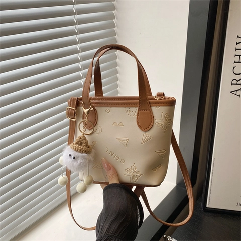 Women Mini Bucket Bag PU Leather Embossed Cartoon Pattern Crossbody Bag Fashion Handbag with Cute Furry Pendant Daily Purse