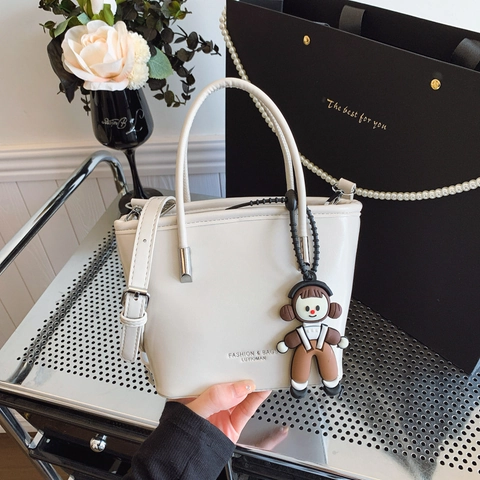 Women's Fashion PU Leather Bucket Bag Minimalist Crossbody Shoulder Bag With Cartoon Doll Pendant Solid Color Trendy Handbag