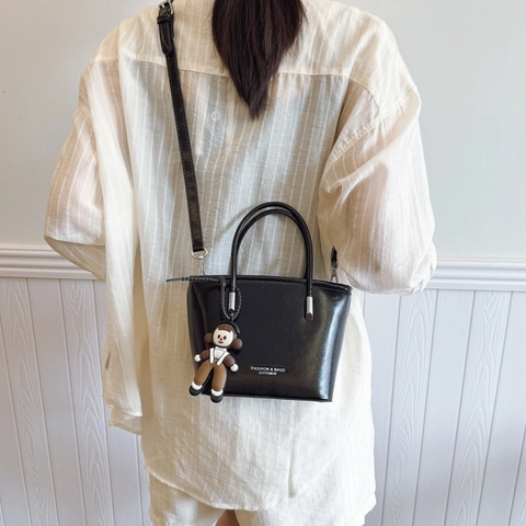 Women's Fashion PU Leather Bucket Bag Minimalist Crossbody Shoulder Bag With Cartoon Doll Pendant Solid Color Trendy Handbag