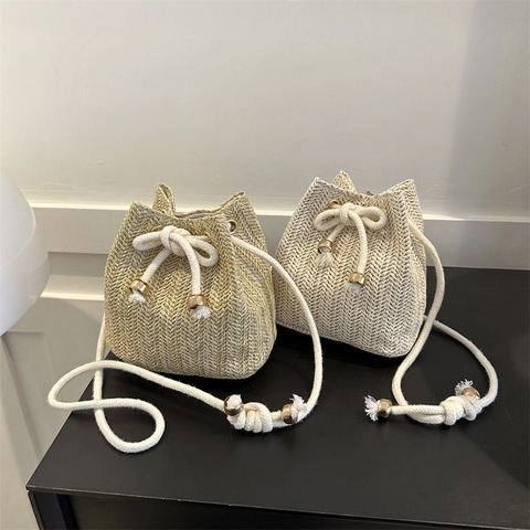 Women's Summer Straw Woven Bucket Bag Small Drawstring Shoulder Crossbody Bag For Beach Vacation With Cotton Rope Strap