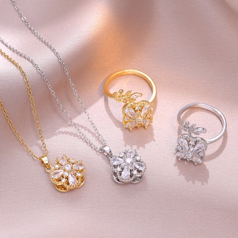 Ensemble de Bijoux Trèfle à Quatre Feuilles Rotatif en Zirconia pour Femmes Acier Inoxydable Plaqué Or Argent Collier Pendentif Pétale Et Bague Réglable Accessoires de Mode