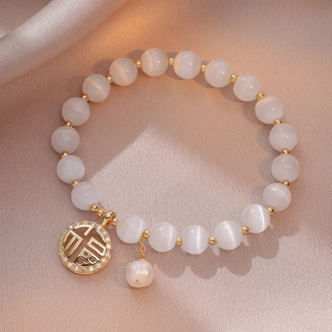 Vintage Koreanischen Stil Weiß Katzenaugenstein Perlenarmband Mit Goldenen Hohl Glück Fu Anhänger Strass Perle Damen Schmuck