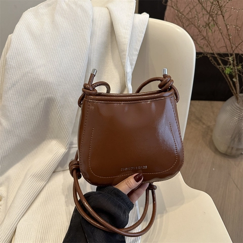 Damen Retro PU Leder Eimertasche Minimalistisch Knoten Riemen Kleine Schulter Umhängetasche Mode Buchstabendruck Tasche