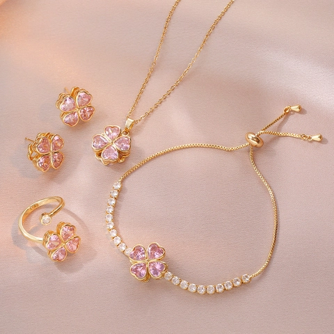 Luxe Rotatif Rose Cœur Zircone Trèfle à Quatre Feuilles Collier Boucles d'Oreilles Bague Ouverte Et Bracelet Bijoux en Acier Inoxydable Plaqué Or