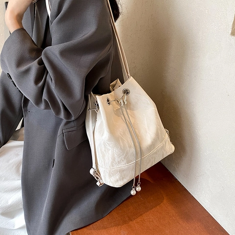 Pleated PU Leather Bucket Bag For Women Butterfly Buckle Artificial Pearl Drawstring Multiway Shoulder Backpack Fashionable Versatile