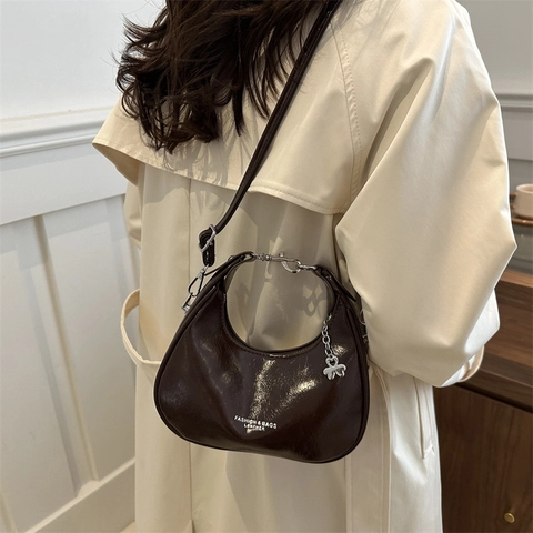 Women Korean Style PU Leather Crescent Shoulder Bag Retro Glossy Hobo Bag With Adjustable Strap Metal Clover Pendant Underarm Bag