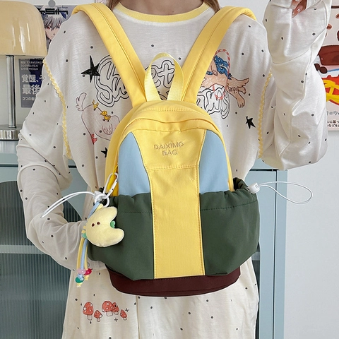 Mini Mochila de Bloques de Color para Mujer Nailon Ligera Casual para Estudiantes Con Colgante de Luna de Peluche