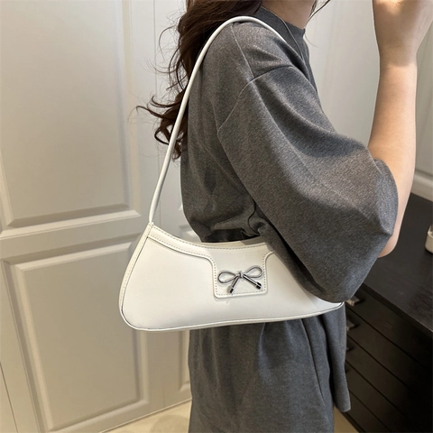 Fashion Bow Knot Underarm Bag 2025 New Korean Style PU Leather Solid Color Commuter Shoulder Baguette Hobo Bag For Women