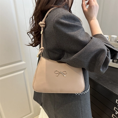 Women PU Leather Underarm Shoulder Bag With Gold Bowknot Buckle And Knotted Strap Elegant Fashion Solid Color
