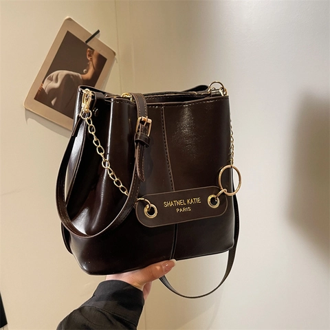 Bolso Cubo Vintage De Cuero PU Para Mujer Retro Textura Brillante Bolso De Hombro Con Cadena Dorada Color Sólido