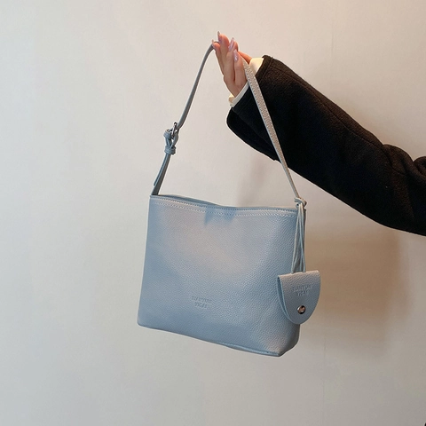 Women Minimalist Litchi Grain PU Leather Bucket Bag Adjustable Shoulder Strap Magnetic Closure Crossbody Bag With Hanging Ornament