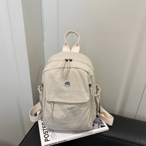 Mochila de Nailon Ligera Minimalista Japonesa para Mujer Moda Color Sólido Casual Viaje Mini Bolso Con Bolsillo Frontal de Cremallera