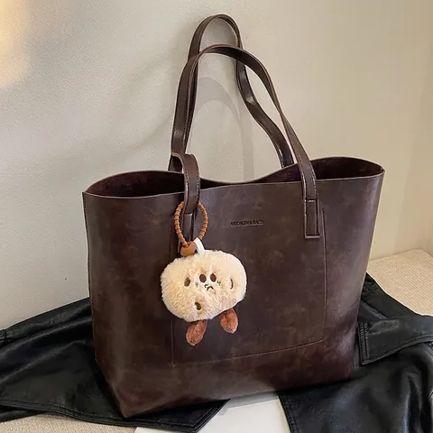 Bolso Tote de Mujer Gran Capacidad Cuero PU Vintage Moda Conmutar Bolso de Hombro Con Colgante de Felpa Otoño Invierno Bolso Shopper Retro Color Sólido