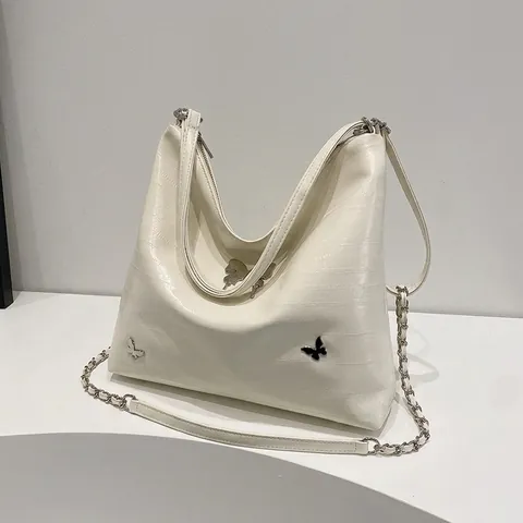 Metallische Schmetterling Deko PU Leder Schultertasche Für Damen Große Kapazität Nische Design Pendler Mehrzweck Rucksack Tragetasche