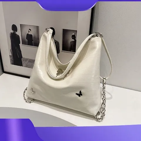 Metallische Schmetterling Deko PU Leder Schultertasche Für Damen Große Kapazität Nische Design Pendler Mehrzweck Rucksack Tragetasche