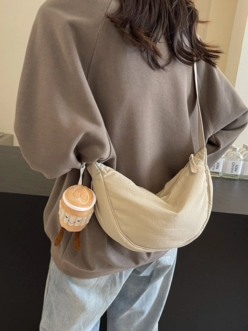 Women Minimalist Nylon Dumpling Crossbody Bag Lightweight Solid Color Moon Shaped Shoulder Bag With Plush Coffee Cup Charm Casual Commuter Bag