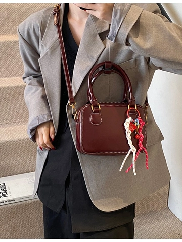 Women's Mini Boston Pillow Crossbody Bag PU Leather Handbag With Contrast Stitching And Decorative Woven Pendant Small Shoulder Bag