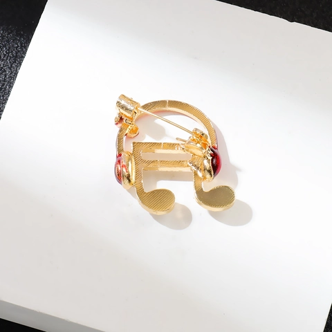 Broche Creativo de Nota Musical y Auriculares Para Mujeres Hombres de Aleación de Zinc Chapado en Oro Esmalte Rojo Strass Joyería Regalo Amante de la Música