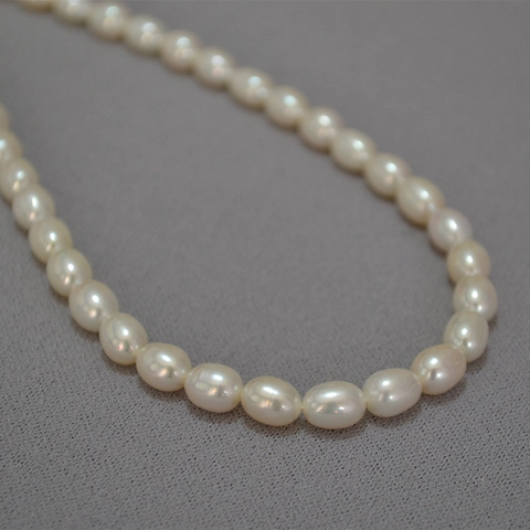 Élégant Collier De Perles D'Eau Douce Style Français Perles Ovales Grain De Riz Chaîne De Clavicule Avec Chaîne D'Extension Femme