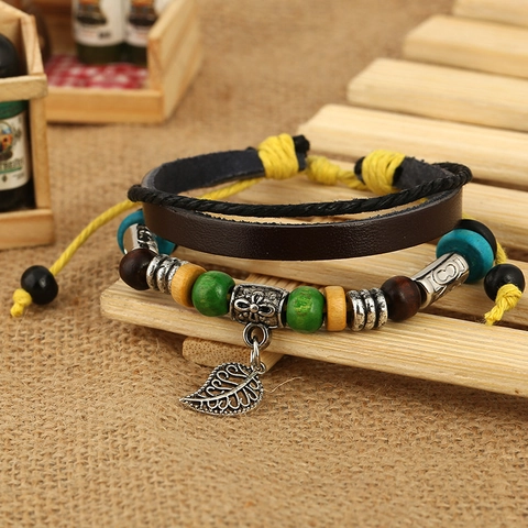 Bracciale in Pelle di Vacchetta Boemia Vintage Fatto a Mano Ciondolo Foglia Lega Perline Legno Multistrato Gioielli Punk Regolabili