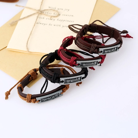 Bracciale in Pelle di Vacca Intrecciato a Mano Retrò WWJD Lettera Placca di Metallo Regolabile Corda Bracciale Unisex Gioielli