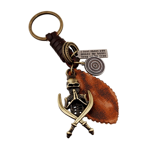 Llavero de Cuero Genuino Tejido Vintage Punk para Hombre Colgante de Calavera de Aleación de Bronce Espadas Cruzadas Gótico