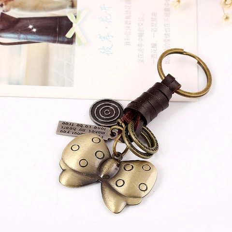 Llavero de Mariposa de Cuero Genuino Tejido Retro Colgante de Aleación de Bronce Vintage Punk Anillo para Llaves