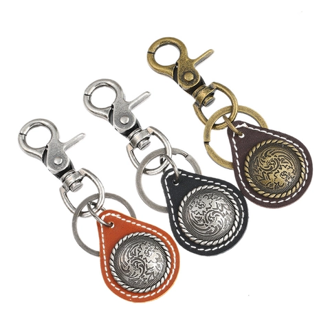 Portachiavi in Pelle Vintage per Uomo Donna in Pelle di Vacchetta Intaglio Floreale in Metallo Stile Punk Pendente per Borsa