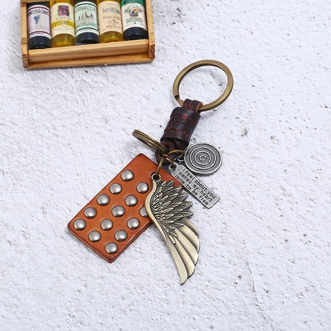 Vintage Geflochtener Rindsleder Schlüsselanhänger Retro Legierung Flügel Inspirierendes Zitat Schlüsselring Punk Stil Tasche Anhänger Geschenk