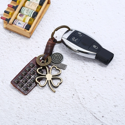 Porte-clés Vintage en Cuir de Vachette Tressé à la Main Pendentif Trèfle à Quatre Feuilles Alliage Anneau Clé Punk Rétro Bijoux