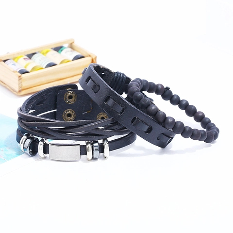 Bracciale in Pelle Multistrato da Uomo Vintage Punk Intrecciato in Pelle di Vacchetta Perline in Legno Ciondolo in Metallo Regolabile