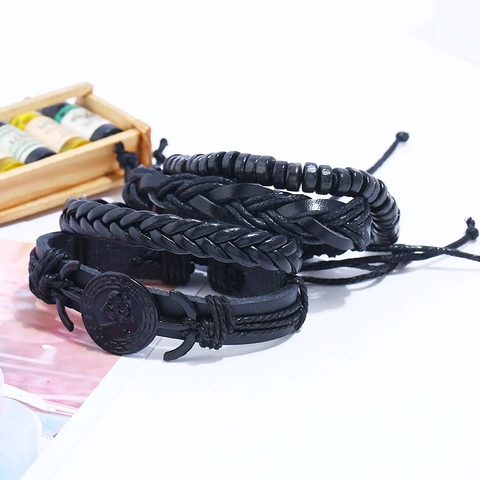 Set di Bracciali Multistrato Punk Vintage da Uomo in Pelle Artificiale Intrecciata Perline di Legno Ciondoli Teschio Ancora