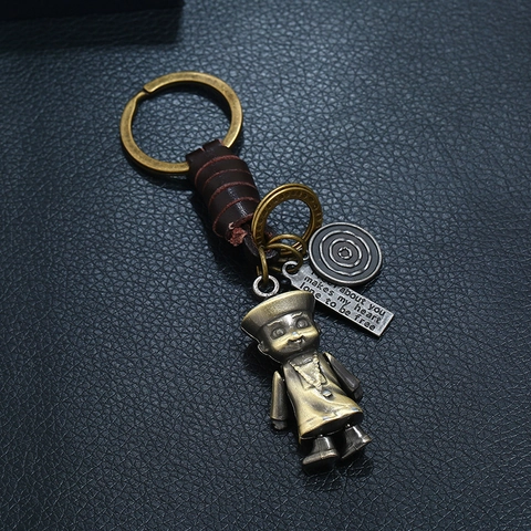 Porte-clés en Cuir de Vachette Tressé Rétro Punk Pendentif Robot Zombie en Alliage Étiquette Gravée Bijoux de Sac
