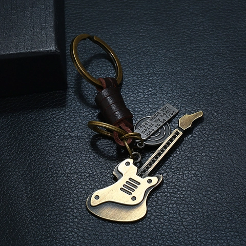 Vintage Gitarre Schlüsselanhänger Geflochtenes Rindsleder Zinklegierung Anhänger Antike Bronze Schlüsselring Für Auto Tasche Anhänger Herren Schmuck