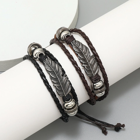 Bracciale in Pelle Intrecciata Multistrato Retrò Con Ciondolo a Piuma in Lega Coulisse Regolabile Punk Uomo Donna Gioielli