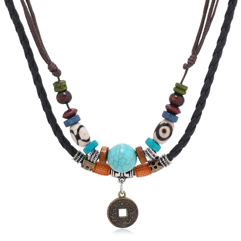 Collana Vintage Etnica a Più Strati in Cordino di Pelle Sintetica Unisex Fatta a Mano con Perle di Legno Turchese Artificiale Pendente Moneta Antica Regolabile Gioielli Boho