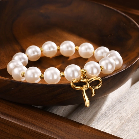 Elegante Bracciale di Perle Artificiali Bianche per Donna Bracciale con Ciondolo a Fiocco in Acciaio Inossidabile Oro Gioielli