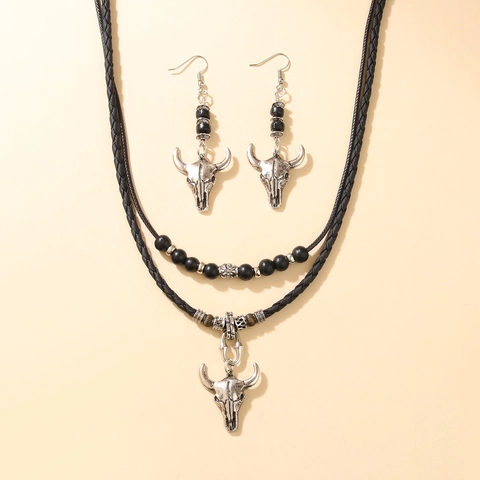 Set Gioielli Vintage Testa di Toro Teschio Donna Collana Pendente Lega Orecchini Corda Intrecciata PU Filo Cerato Perle Artificiali