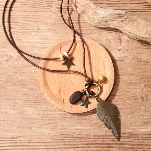 Collana Doppia Retro Boho con Ciondolo a Piuma Vintage in Lega Foglia Stella Marina Stella Lunga Catena Maglione Unisex Gioielli