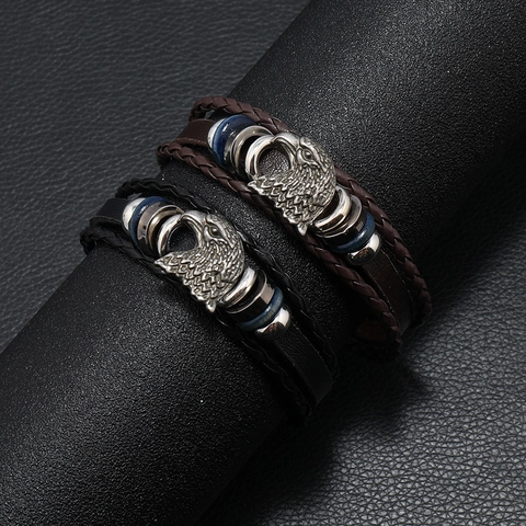 Bracciale Retrò da Uomo Cinturino in Pelle Intrecciata Multistrato Ciondolo Testa di Aquila Intagliata Gioielli Punk Bohémien Lega PU