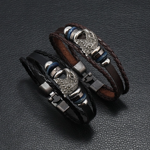 Bracciale Retrò da Uomo Cinturino in Pelle Intrecciata Multistrato Ciondolo Testa di Aquila Intagliata Gioielli Punk Bohémien Lega PU