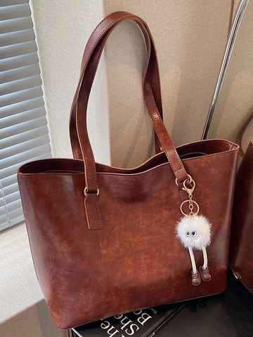 Women Vintage PU Leather Tote Bag Large Capacity Minimalist Shoulder Bag With Plush Monster Pendant Fashion Commuter Handbag